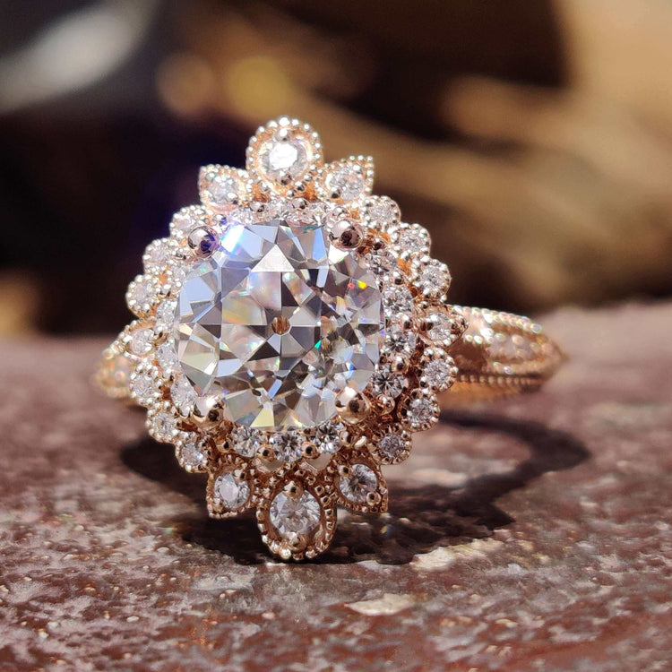 Old European cut moissanite ring in rose gold.