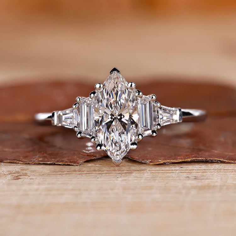 5 Stone Diamond Ring is made with marquise cut diamond ring and white gold ring.