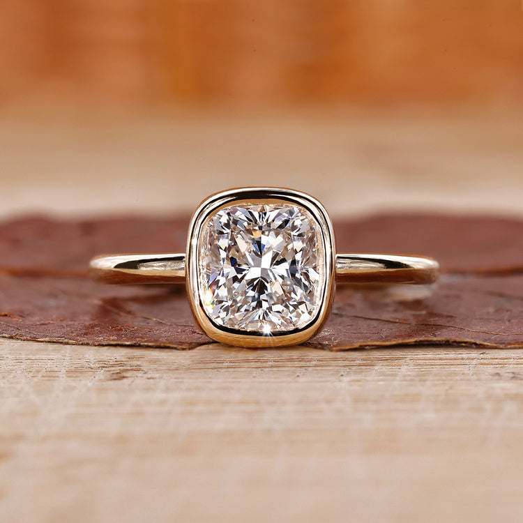 Solitaire Diamond Ring is crafted using a cushion cut diamond ring and yellow gold ring.