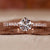 Elegant hidden halo ring with sparkling diamonds and a delicate finish. Elegant hidden halo ring with sparkling diamonds and a delicate finish.