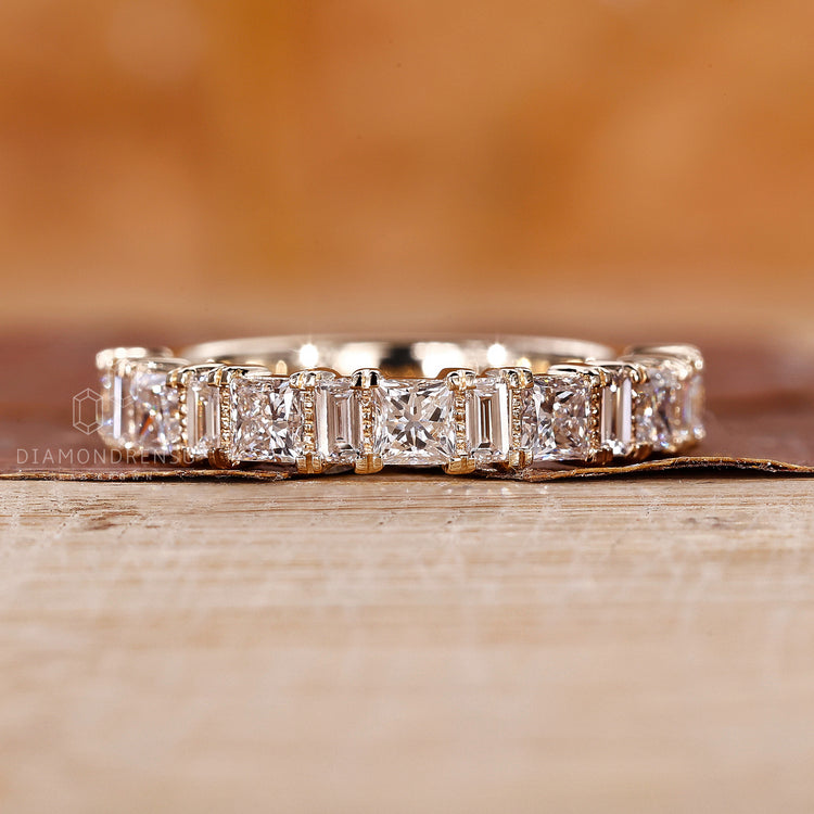 Yellow gold diamond band designed with a clean half eternity style.