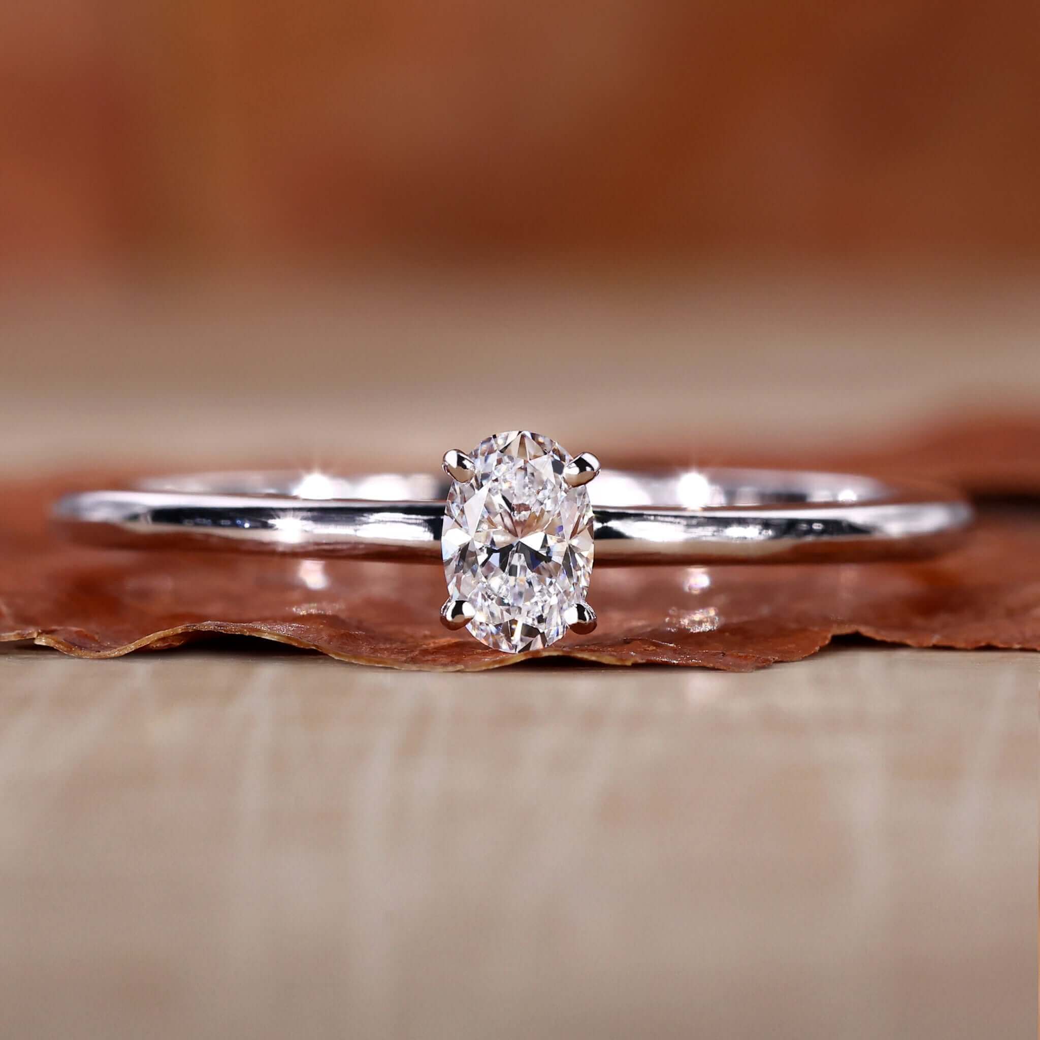 Oval cut ring with Lab Grown Diamond in a 4 prong diamond setting, perfect for a timeless engagement.