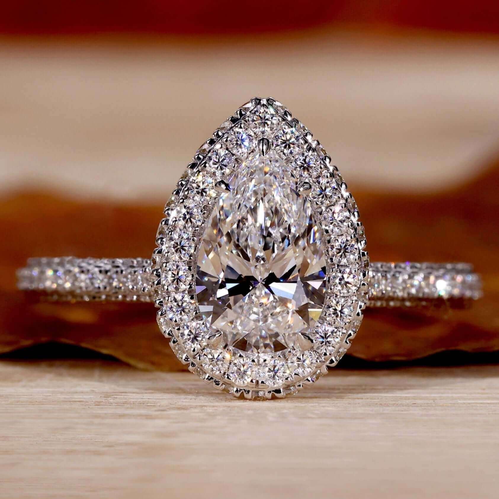 Teardrop engagement ring with pear diamond and elegant design for timeless charm.