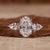 Three stone ring featuring an oval diamond with pear side stones, perfect for a unique engagement ring design. Three stone ring featuring an oval diamond with pear side stones, perfect for a unique engagement ring design.