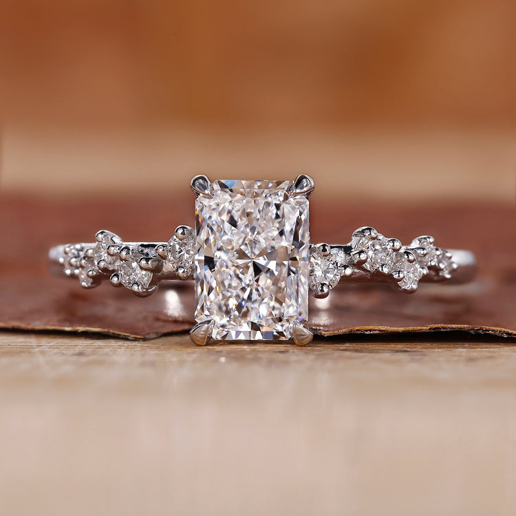 Radiant cut diamond ring with claw prong ring setting.
