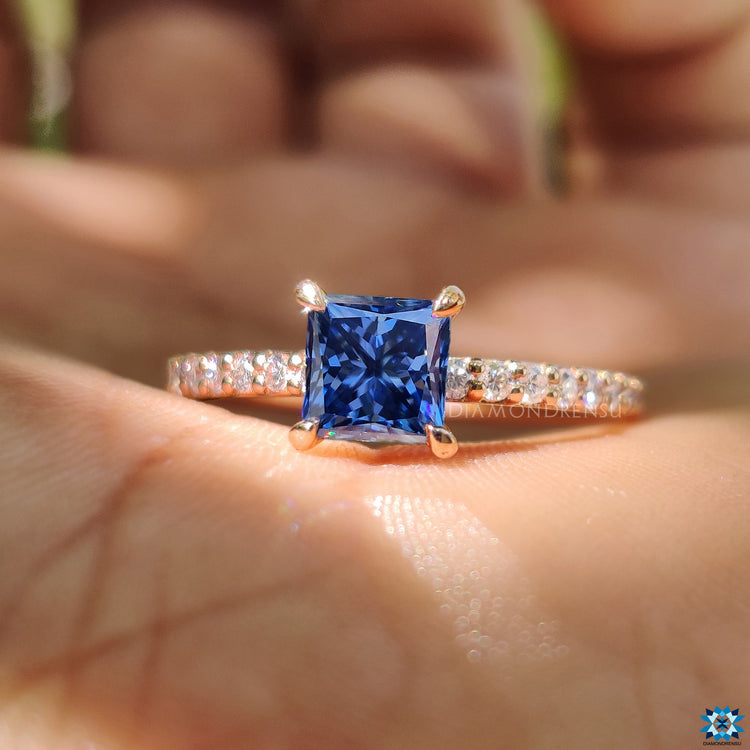 Handmade jewelry with princess cut moissanite and round cut pave band in rose gold.