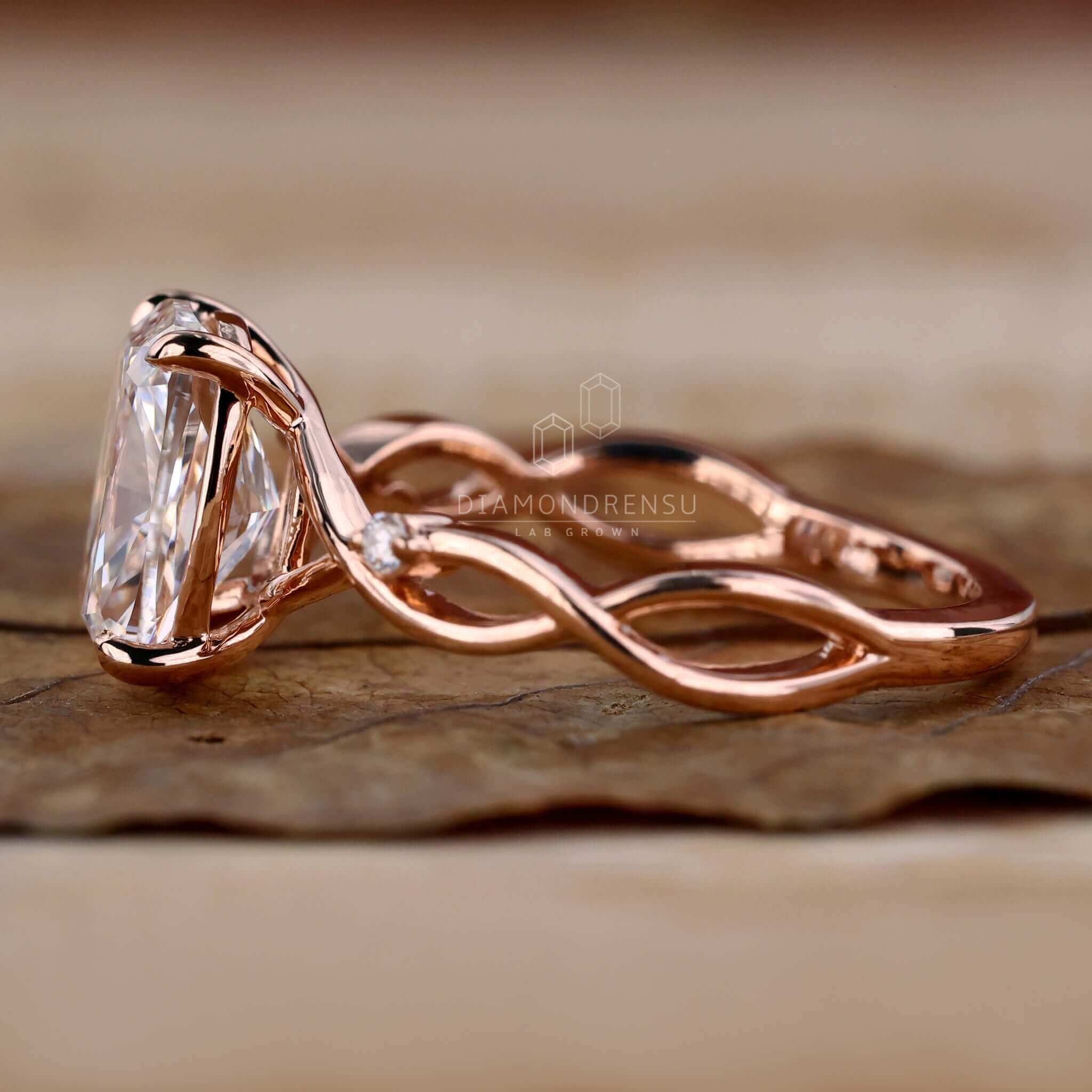 Unique elongated cushion cut diamond with a twisted band.