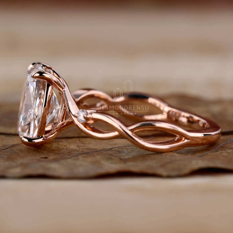 Unique elongated cushion cut diamond with a twisted band.