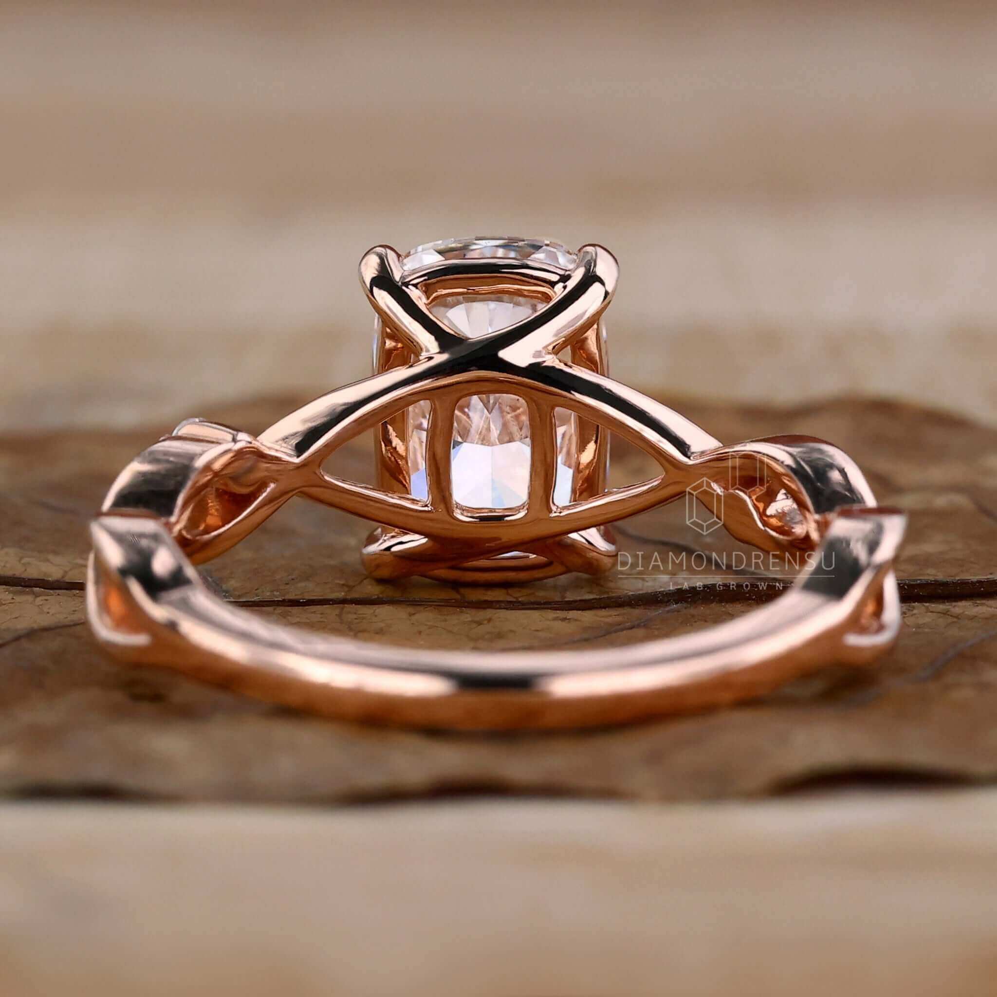 Handmade ring with an elongated cushion cut and side stones.