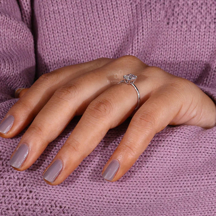 Diamond ring radiant cut with a 4-prong claw setting for a secure hold.