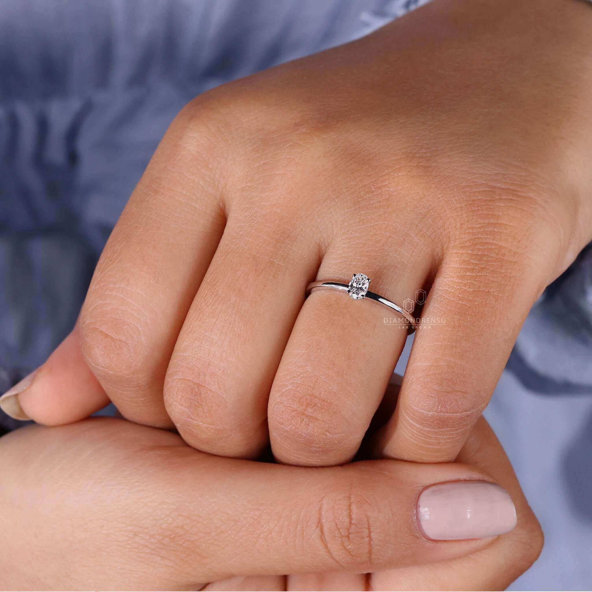White gold ring with a 2 carat oval diamond, ideal for women seeking a unique engagement ring crafted to perfection.