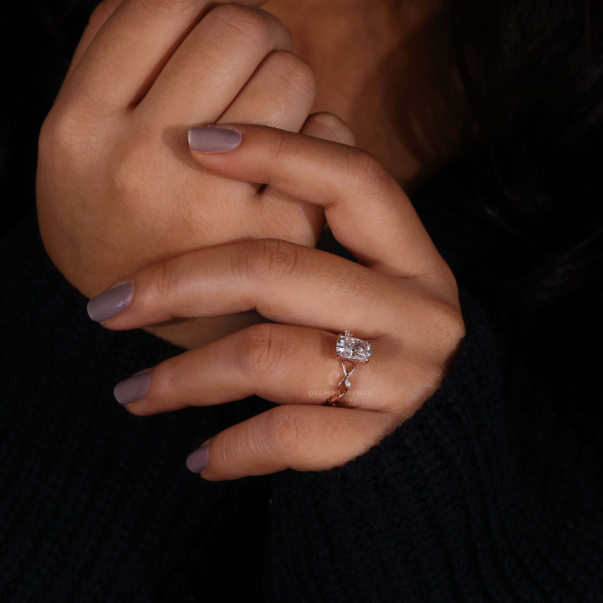 Diamondrensu UK engagement ring in a claw prong setting.