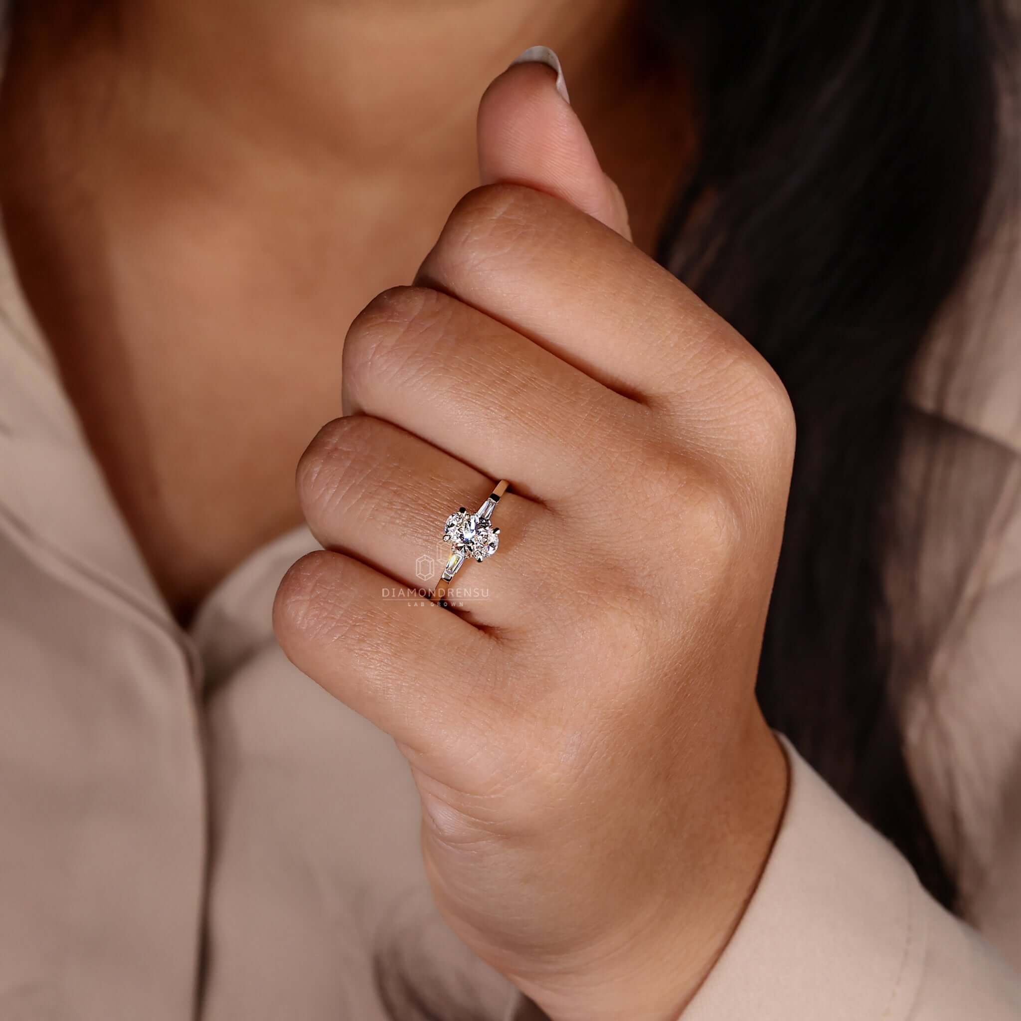 Oval shaped engagement ring with a claw prong setting and stunning baguette cut diamond ring design.