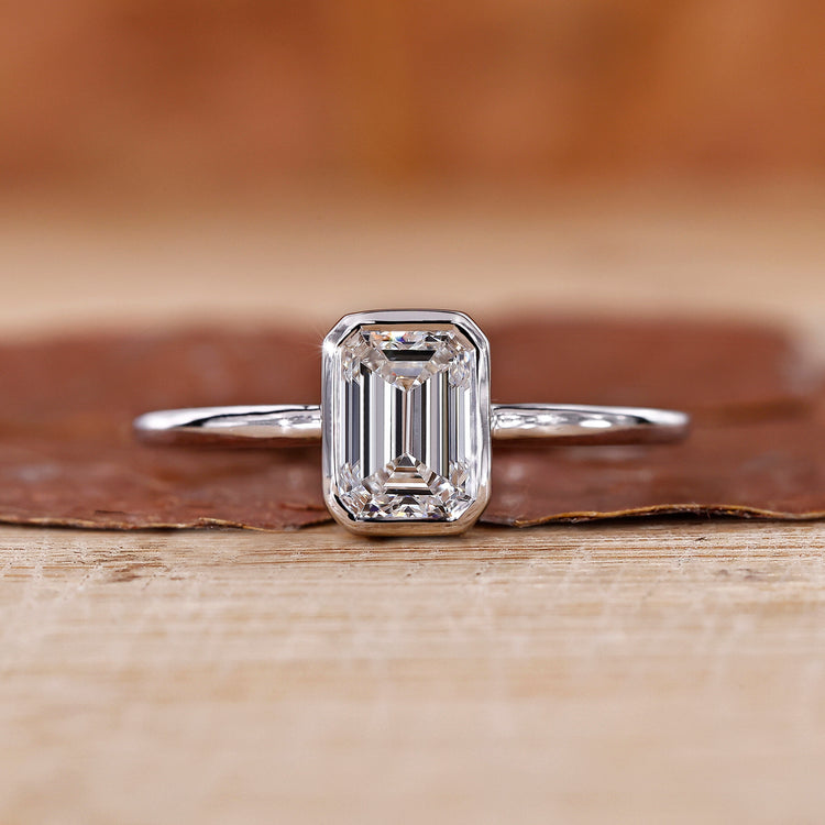 Emerald cut engagement ring with a minimalist design.