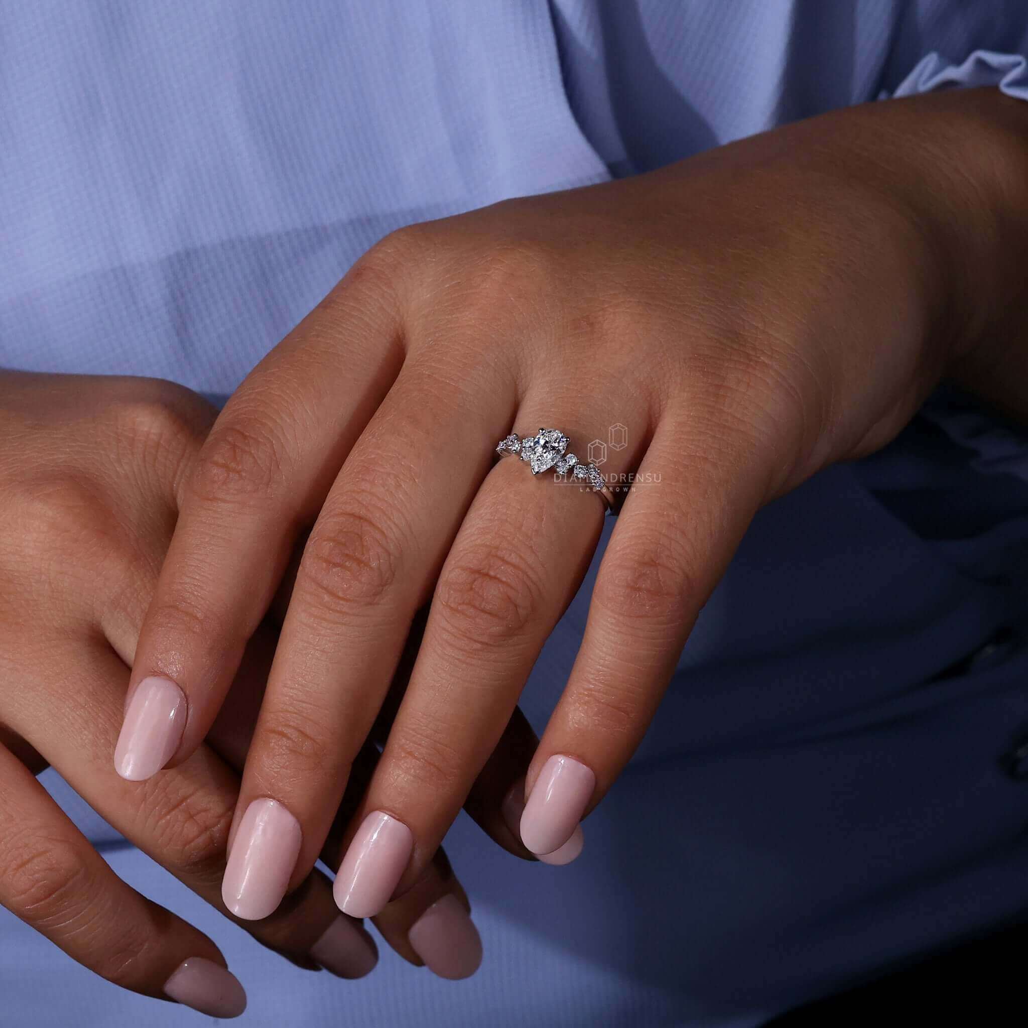 Pear cut diamond engagement ring with a stunning zig zag pave design, ideal for UK engagement ring seekers.