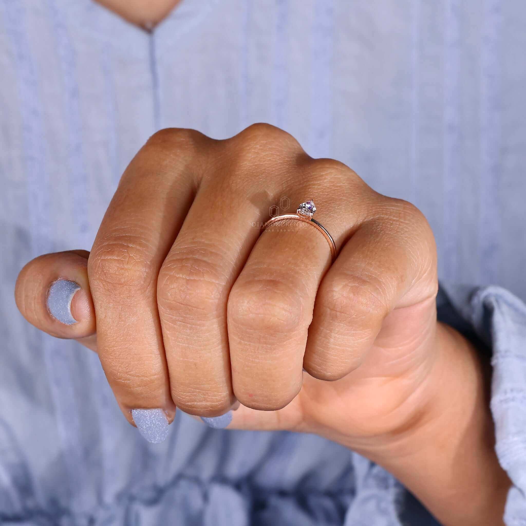 Round prong pear shape ring made with lab-grown diamonds.