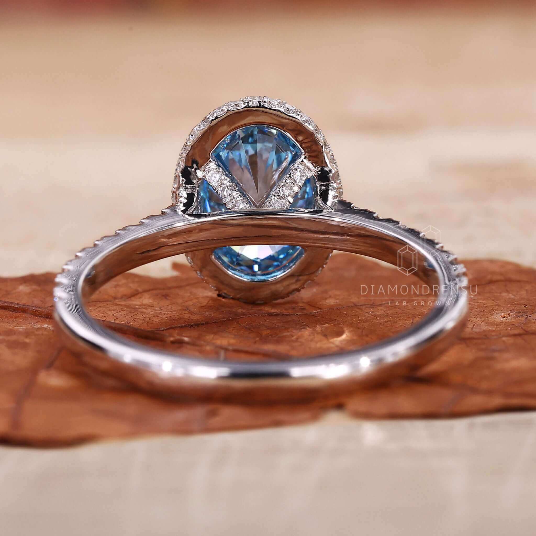 Engagement ring with pave accents and an oval engagement ring with a halo ring setting.
