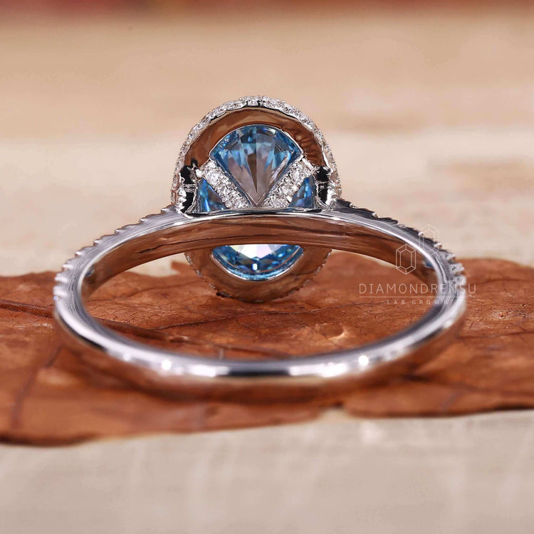 Engagement ring with pave accents and an oval engagement ring with a halo ring setting.