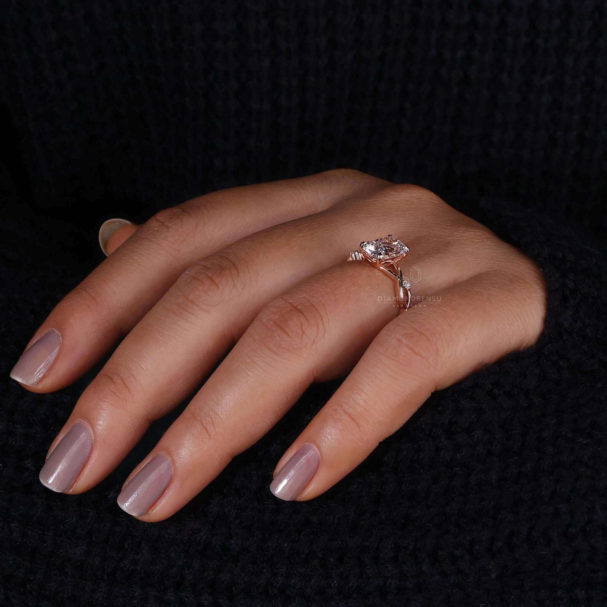 IGI certified round engagement ring with handmade detailing.