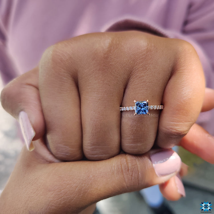 UK engagement ring with royal dark blue princess cut moissanite and round pave band.