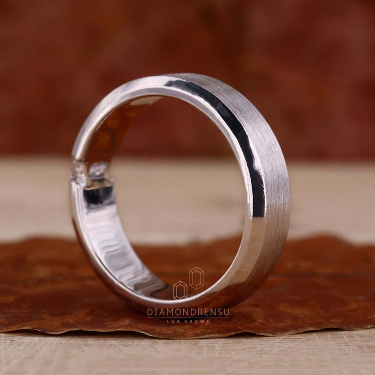 Baguette diamond band paired with a white gold engagement ring for classic charm.