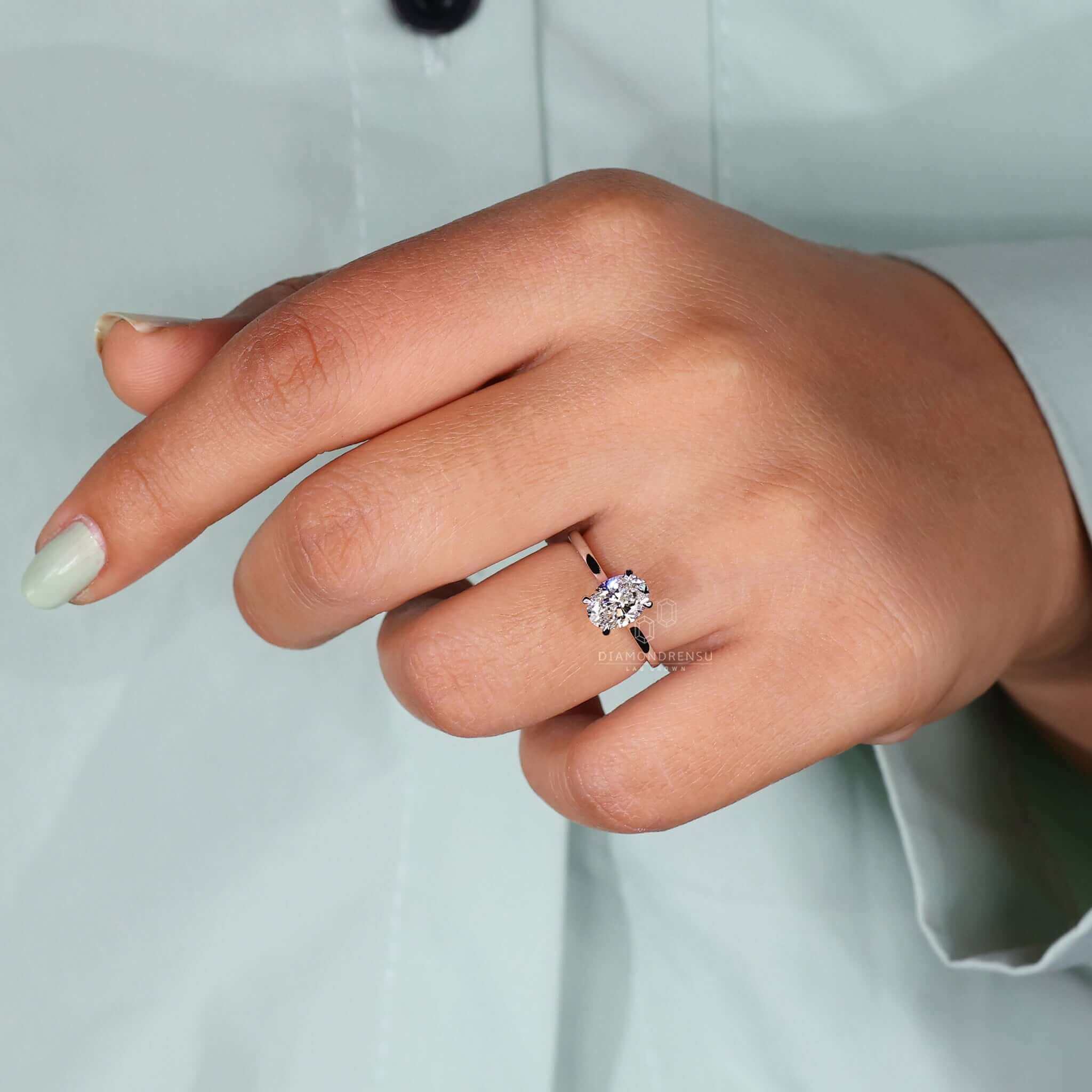 Elegant oval cut engagement ring showcasing lab grown diamond in a classic design.