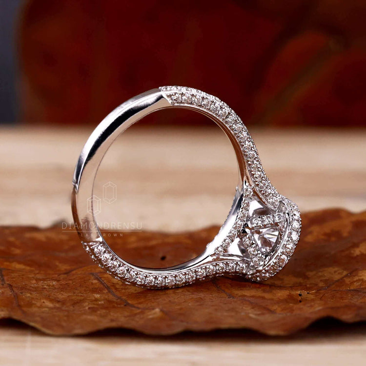 Double halo ring paired with a 5 prong claw setting for security and elegance.