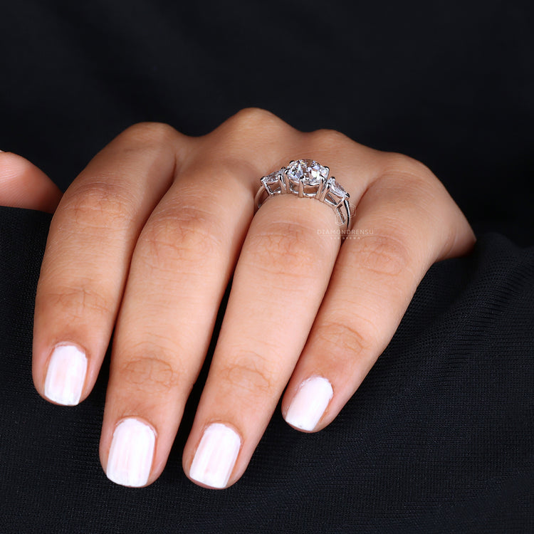 Three stone engagement ring in white gold.