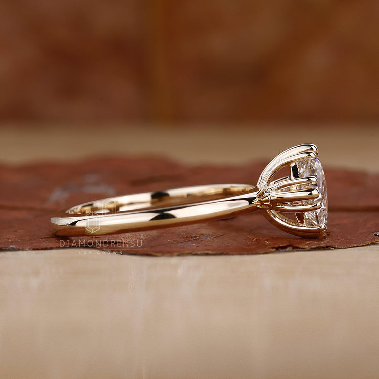 Triple compass prong setting with Asscher cut.