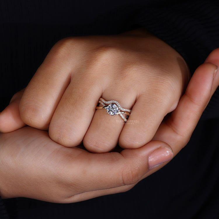 Round cut diamond center stone ring.
