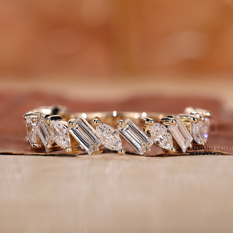 Half eternity band with baguette and marquise diamonds.
