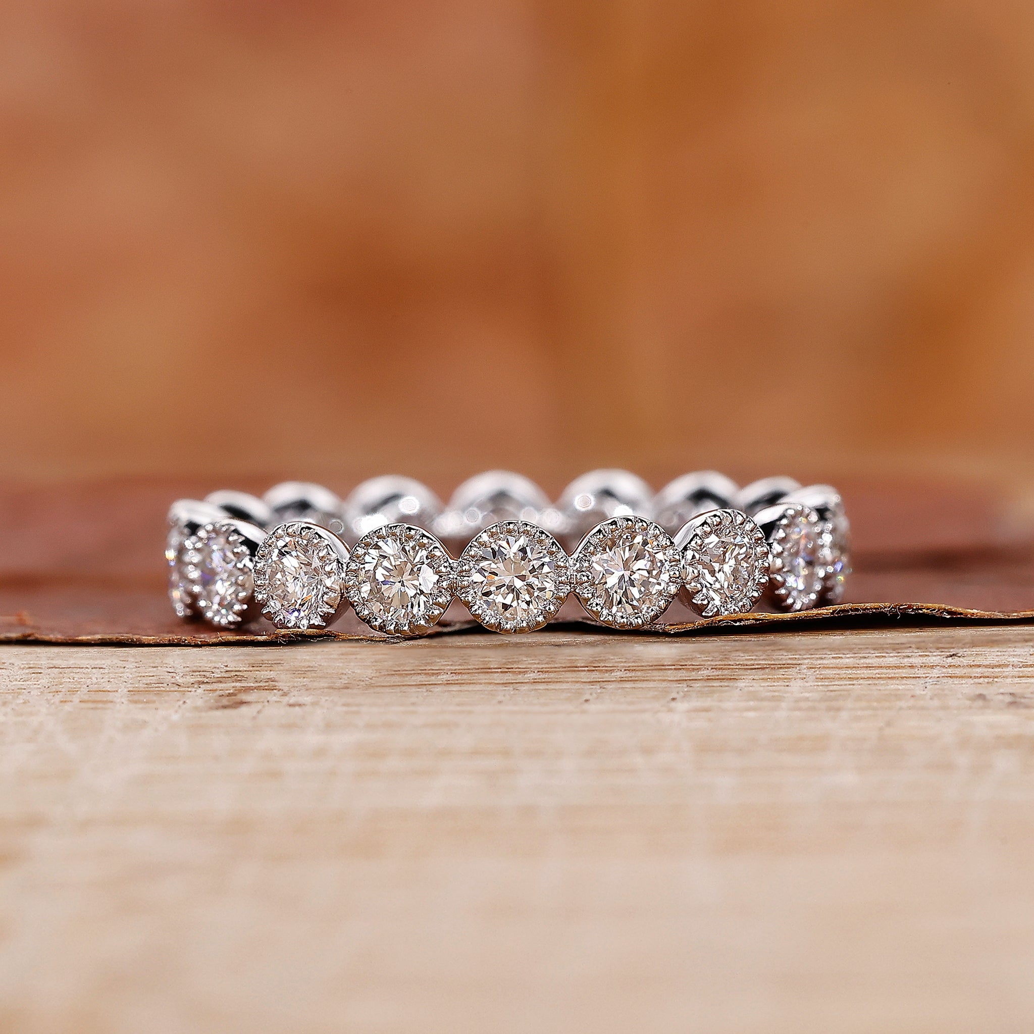 Bezel set eternity wedding band in white gold.