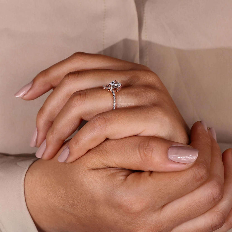 Rose gold diamond ring with a unique pear shaped ring design, crafted for elegance and charm.