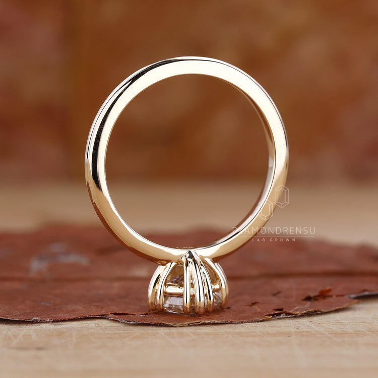 UK engagement ring in solitaire gold design.