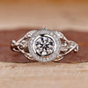 Nature inspired engagement ring with round brilliant cut diamond.