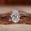 Oval cut diamond ring in white gold with claw prong setting, perfect for engagements.