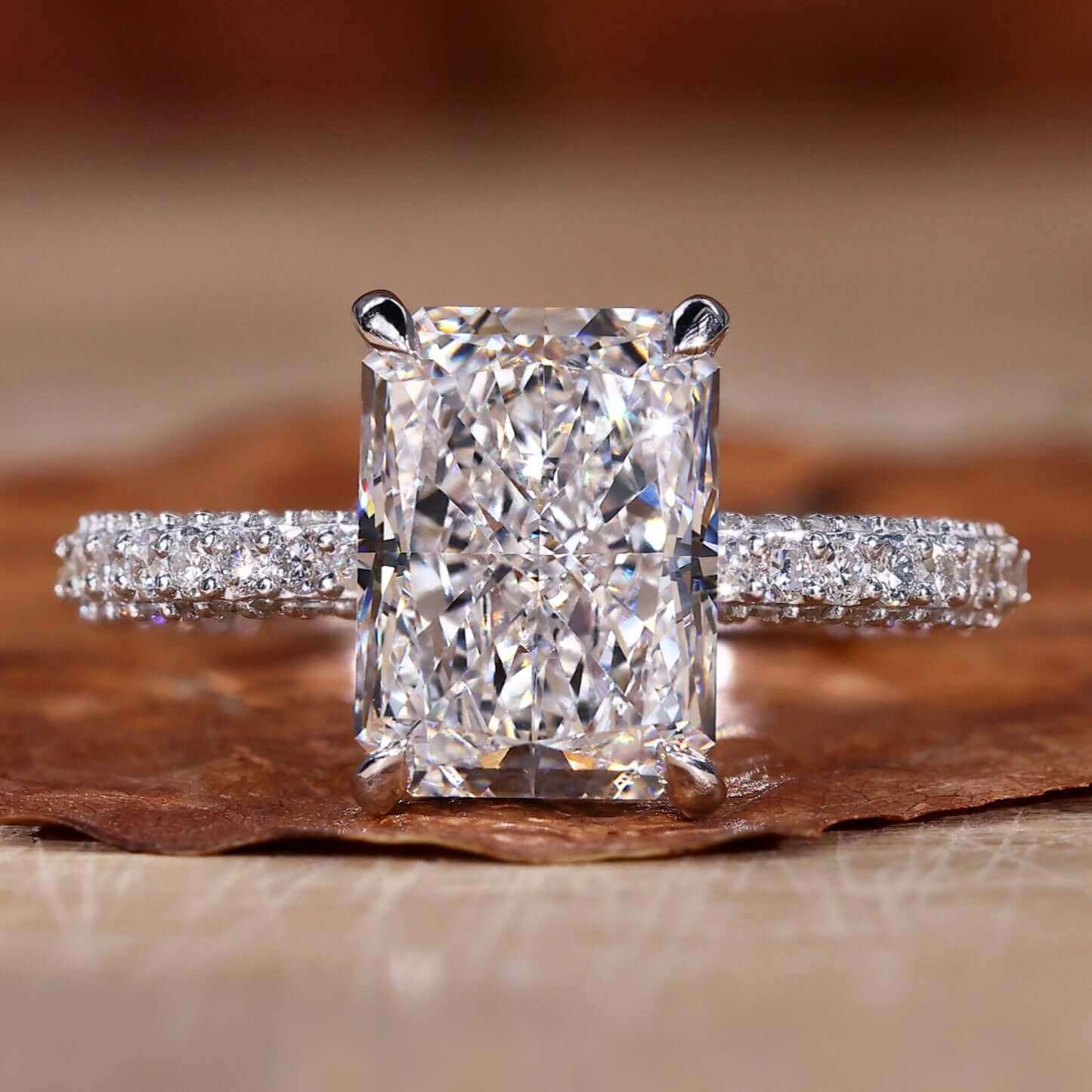 Radiant engagement ring with hidden halo and IGI certified diamond.