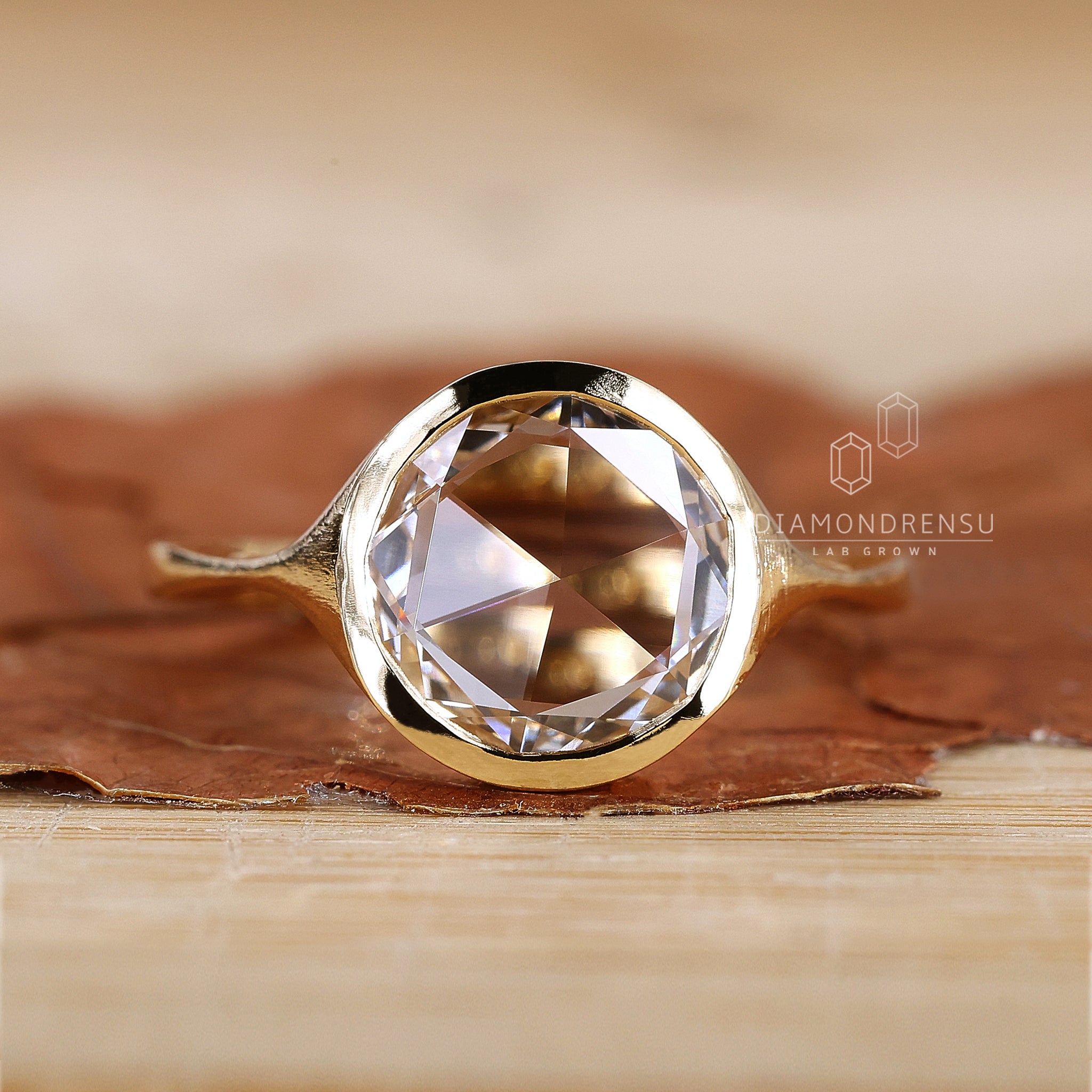 Bezel setting solitaire engagement ring.