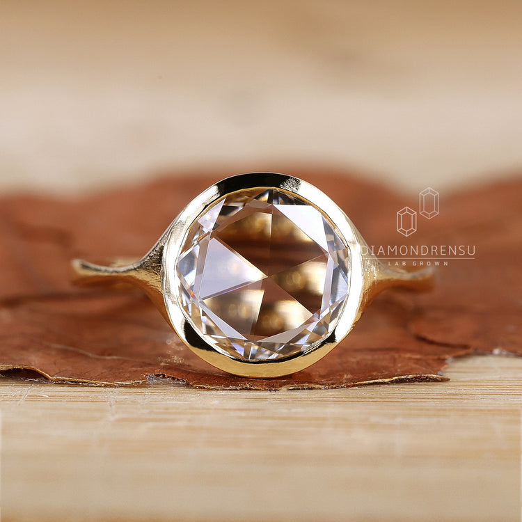 Bezel setting solitaire engagement ring.