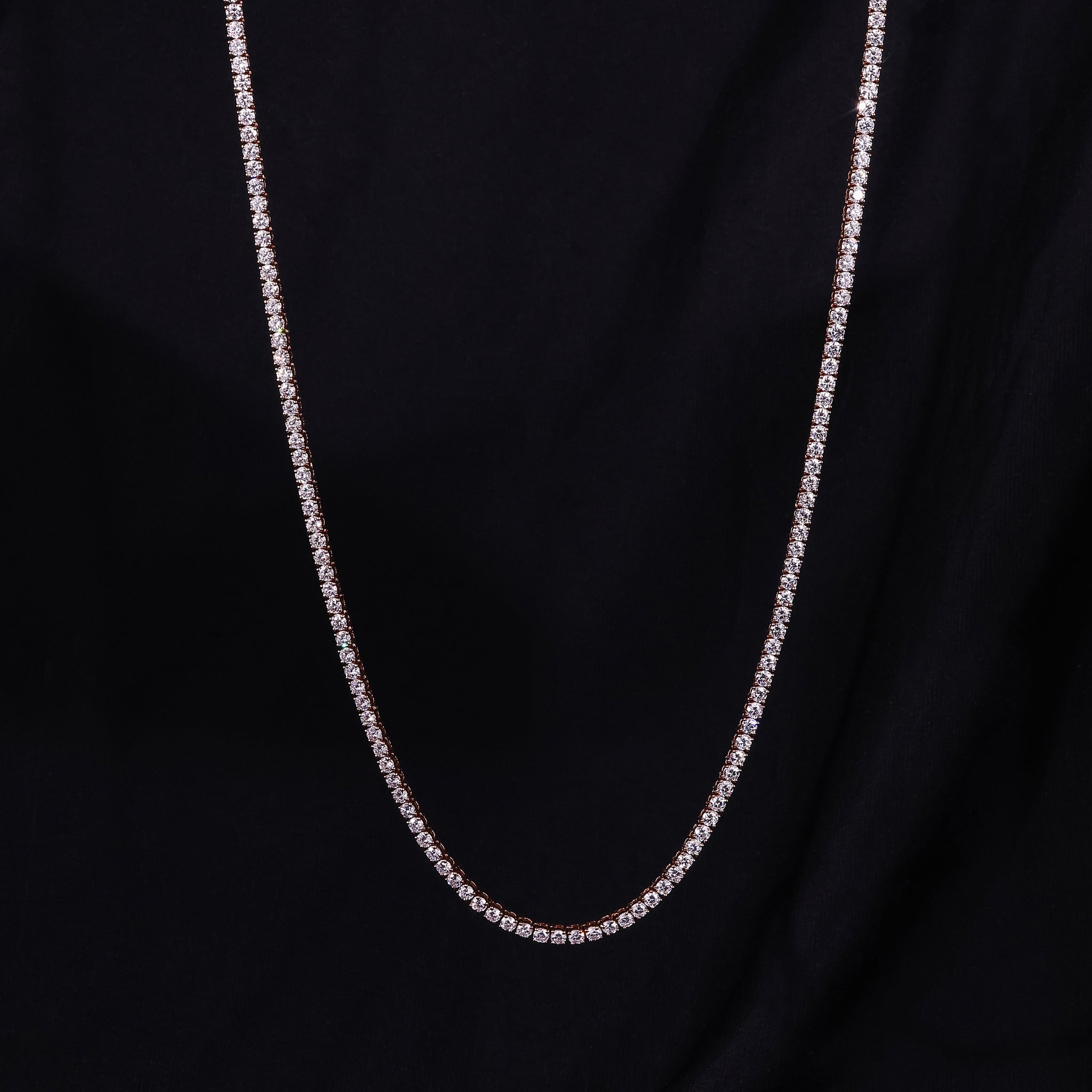 Diamond tennis necklace crafted in rose gold with round diamonds.