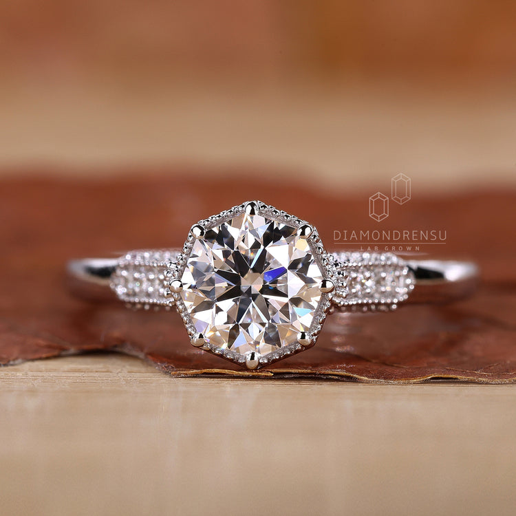 Round cut side stone in vintage ring style.