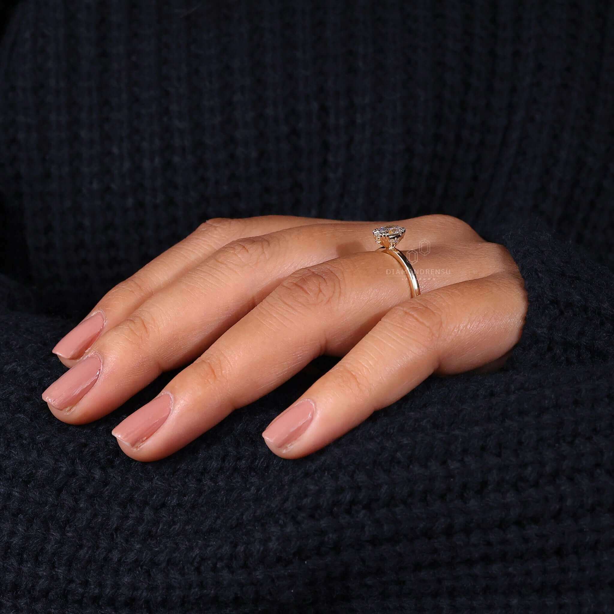 Solitaire engagement ring featuring handmade craftsmanship.