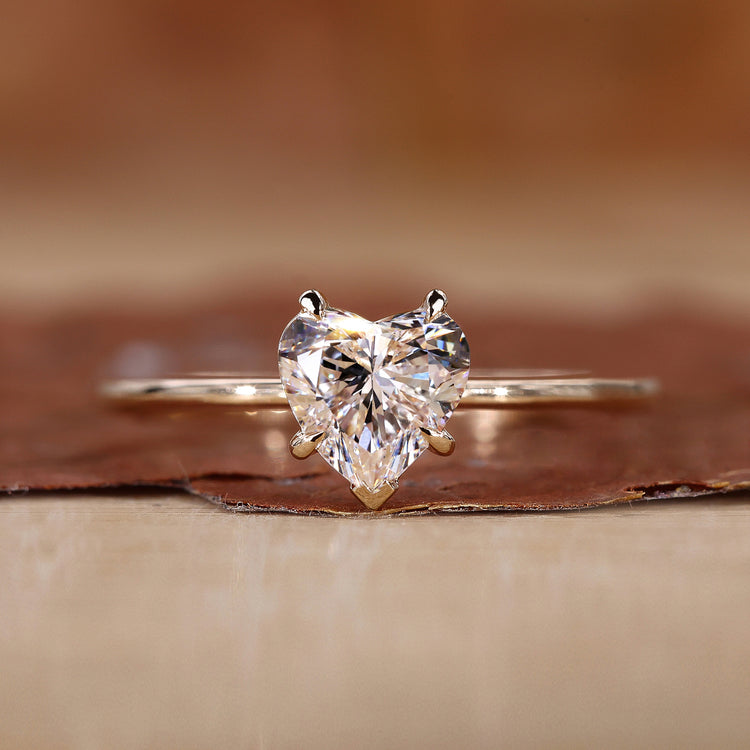 Heart shaped diamond ring in yellow gold.