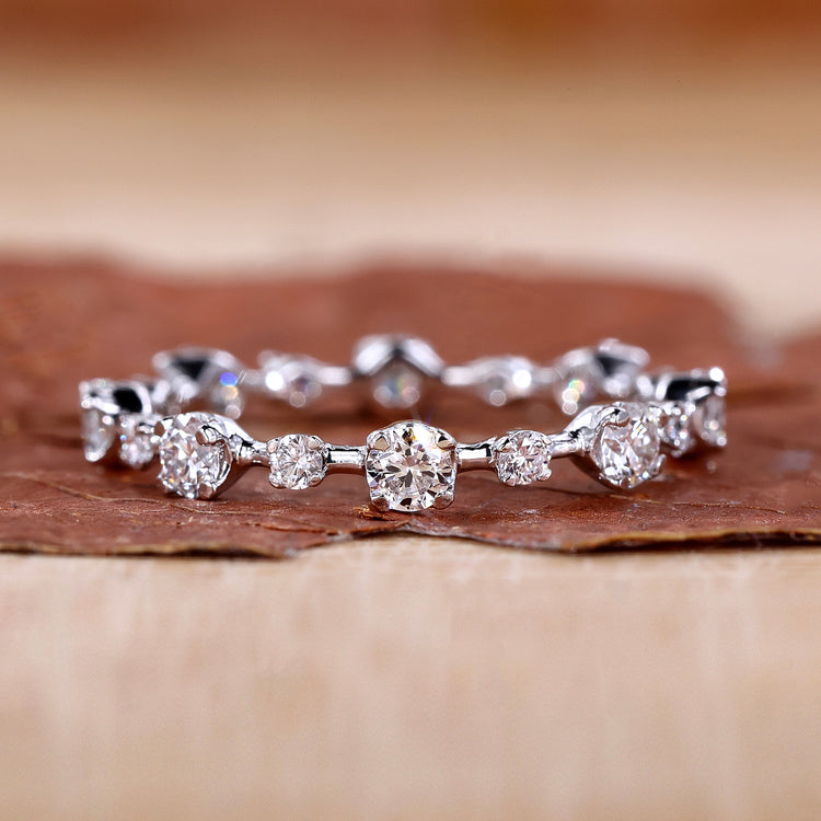 Eternity wedding band with round cut diamonds in white gold