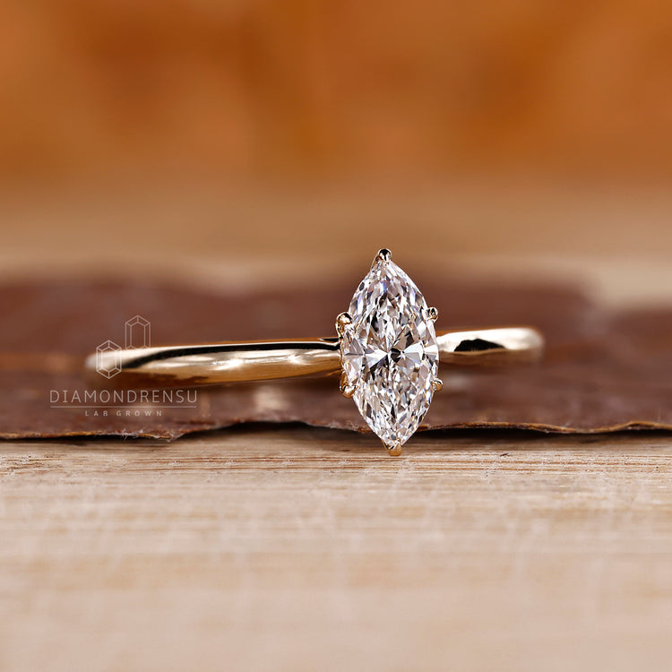 Tulip setting ring with marquise cut lab grown diamond.