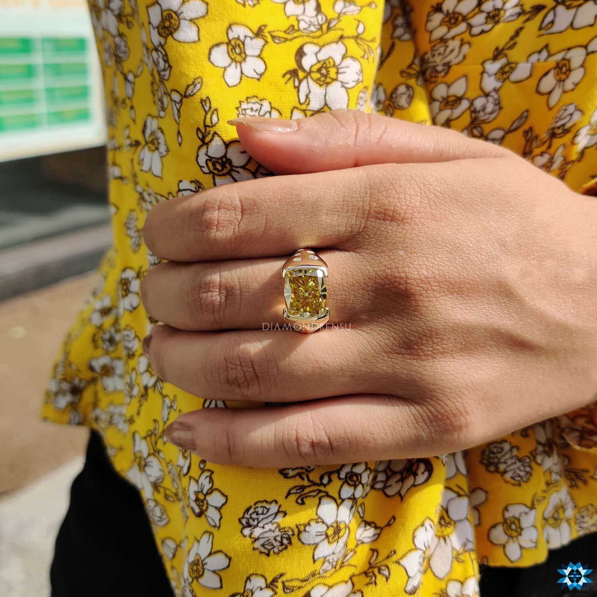 Handmade engagement ring with flush setting and tapered shank design.