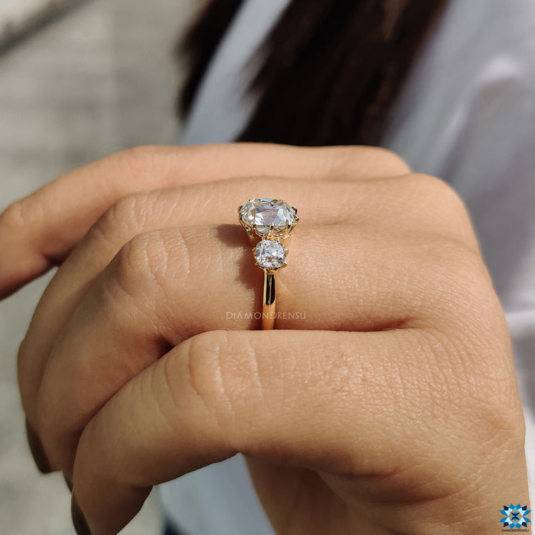 Yellow gold ring with three stone ring