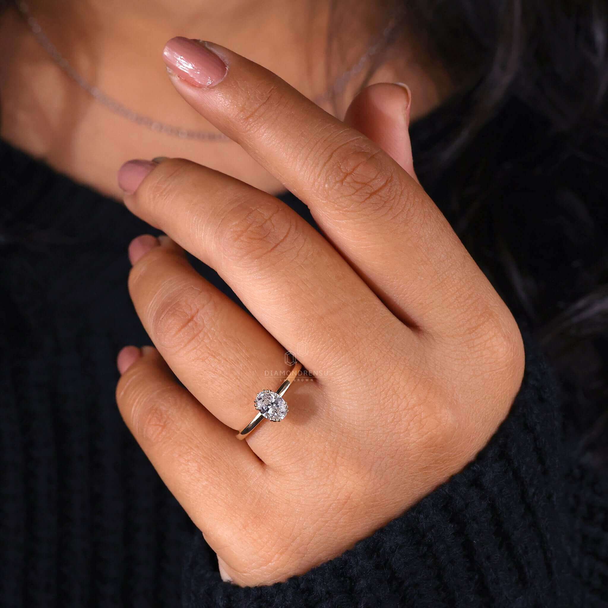Oval diamond engagement ring with 3 prong ring settings.