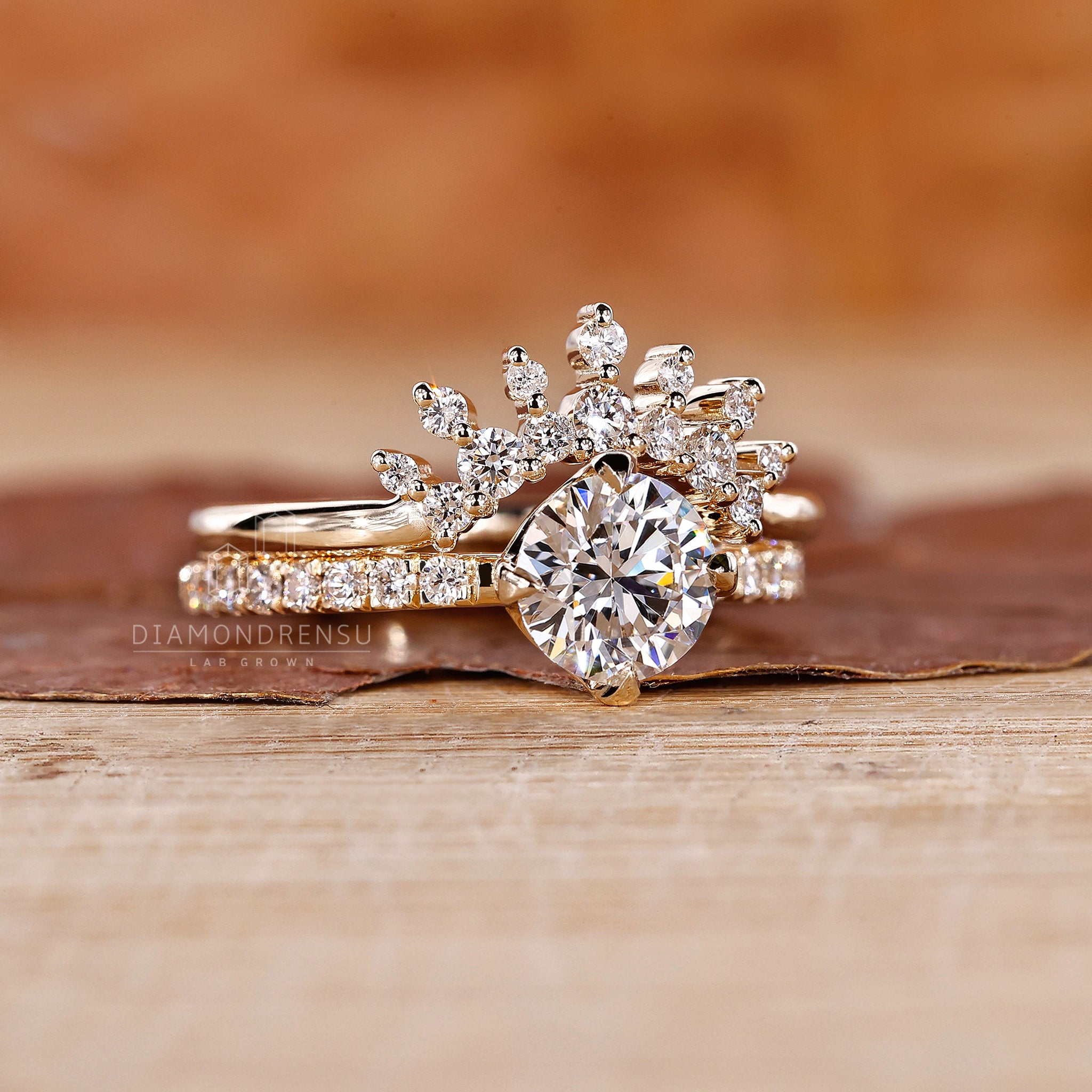Yellow gold bridal set designed with a round diamond and crown wedding band.