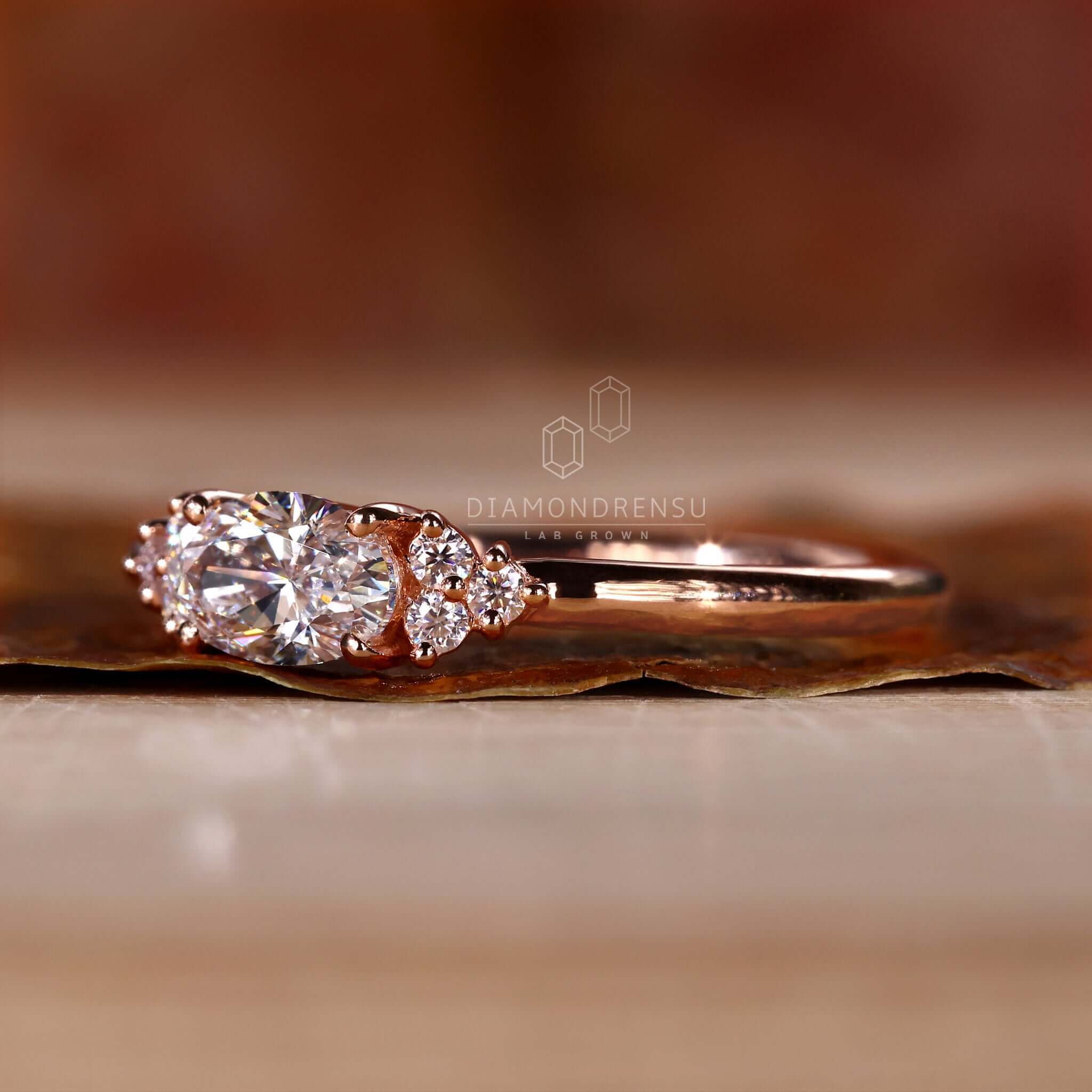 Gold oval diamond ring in a unique handmade style, perfect for engagement occasions.